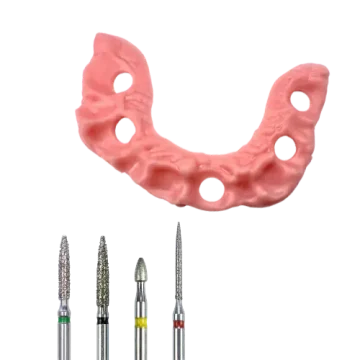 3D-printed pink U-shaped GVA-26 gingival mask with 4 holes beside black dental burs